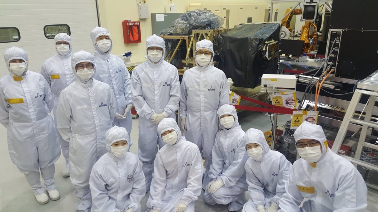 Professor Kim and his students performing a final check on the GEMS instrument before launch at KARI